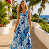 Woman wearing a tropical Hibiscus Water Color Hawaiian dress from Shaka time Hawaii